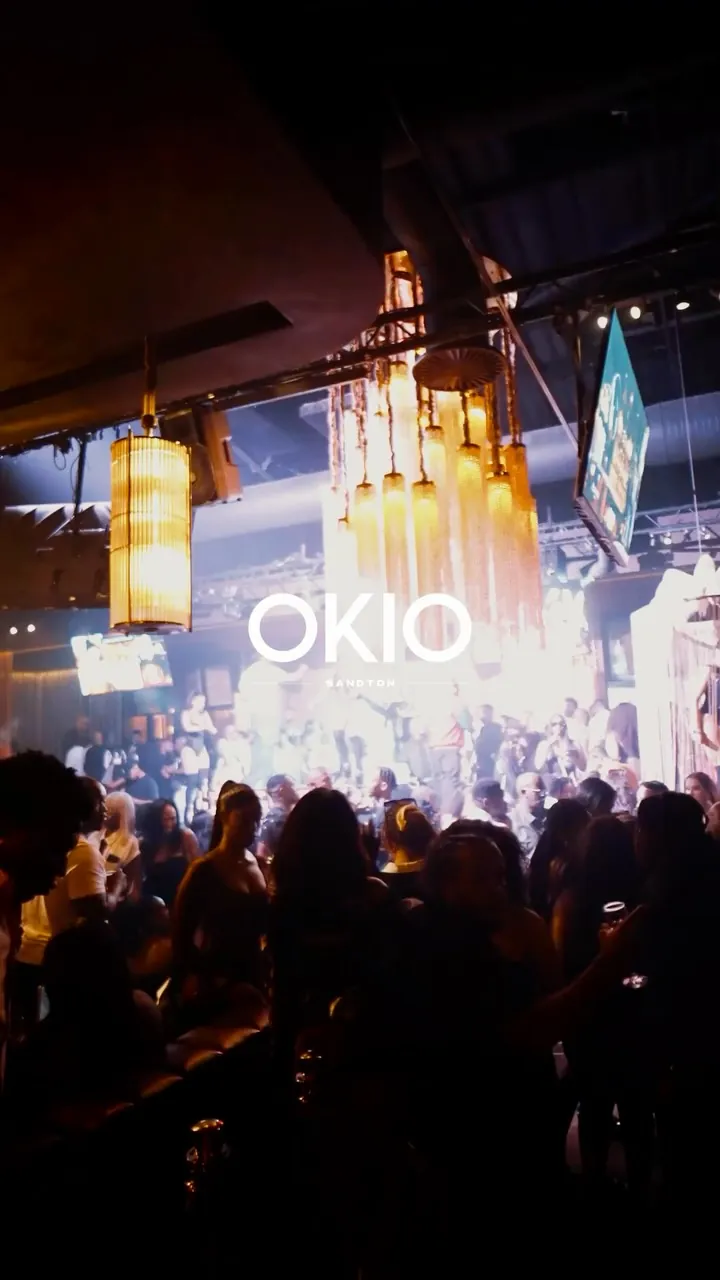 Crowd facing the OKIO screen